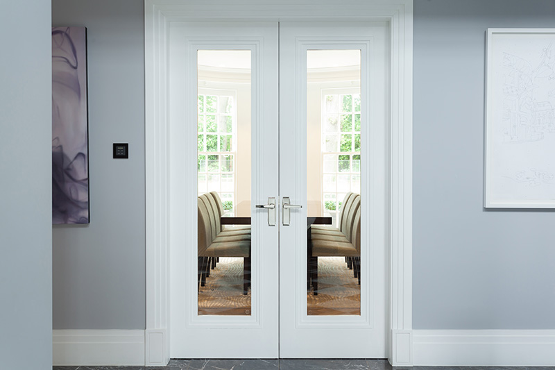 Glass Panelled Double Doors Looking Into Meeting Room