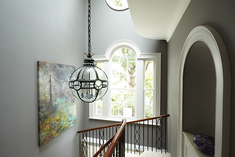 Ornate Lamp Hanging Over Stairs