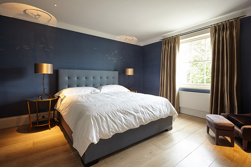 Dark Blue and Gold Accented Bedroom