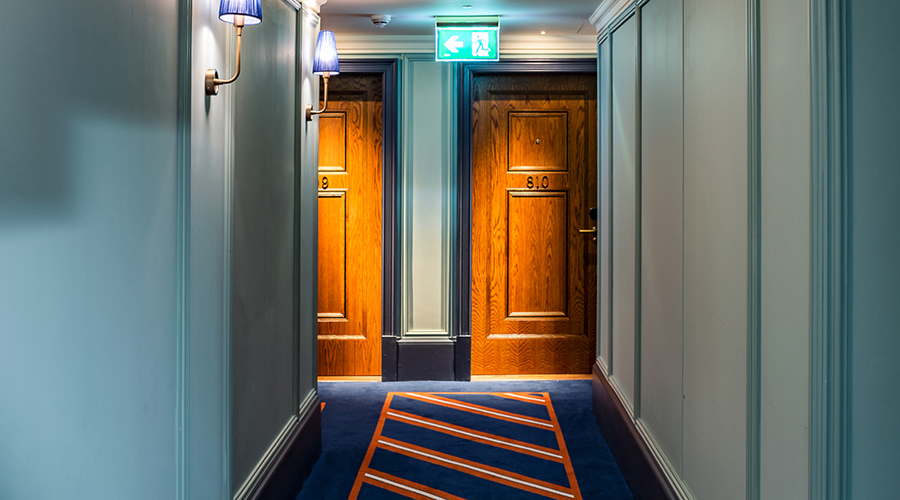 Inteiror Hallway of Hotel, Strada London Door Furniture on Hotel Doors.