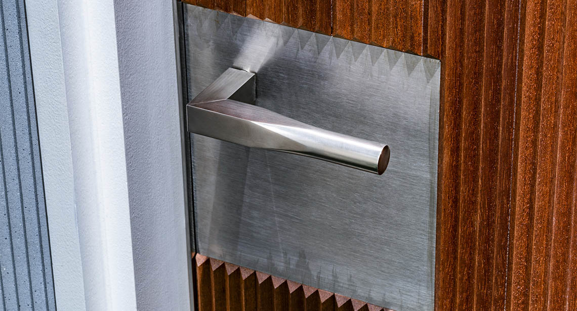 Silver Door Handle On Wood Door